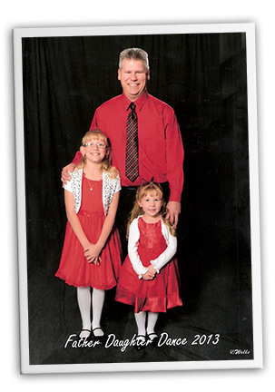 Dave Rozmarich with his two daughters